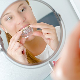 Woman placing oral appliance